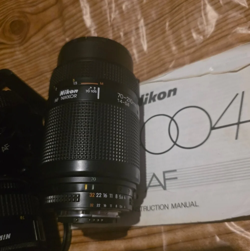Nikon N4004 AF camera w/ 2 lenses, Flash, Film and Accessories